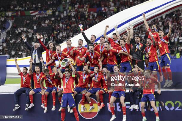 Players of Spain celebrate with the trophy during a ceremony after winning against England at the UEFA EURO 2024 final match between Spain and...