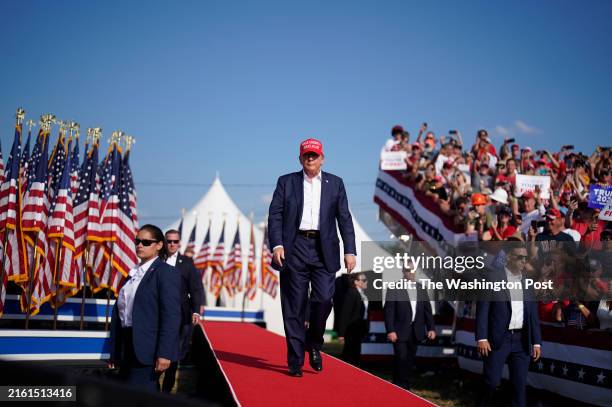 July 13: Former president Donald Trump walks onstage during a campaign rally for former President Donald Trump at Butler Farm Show Inc. On Saturday,...