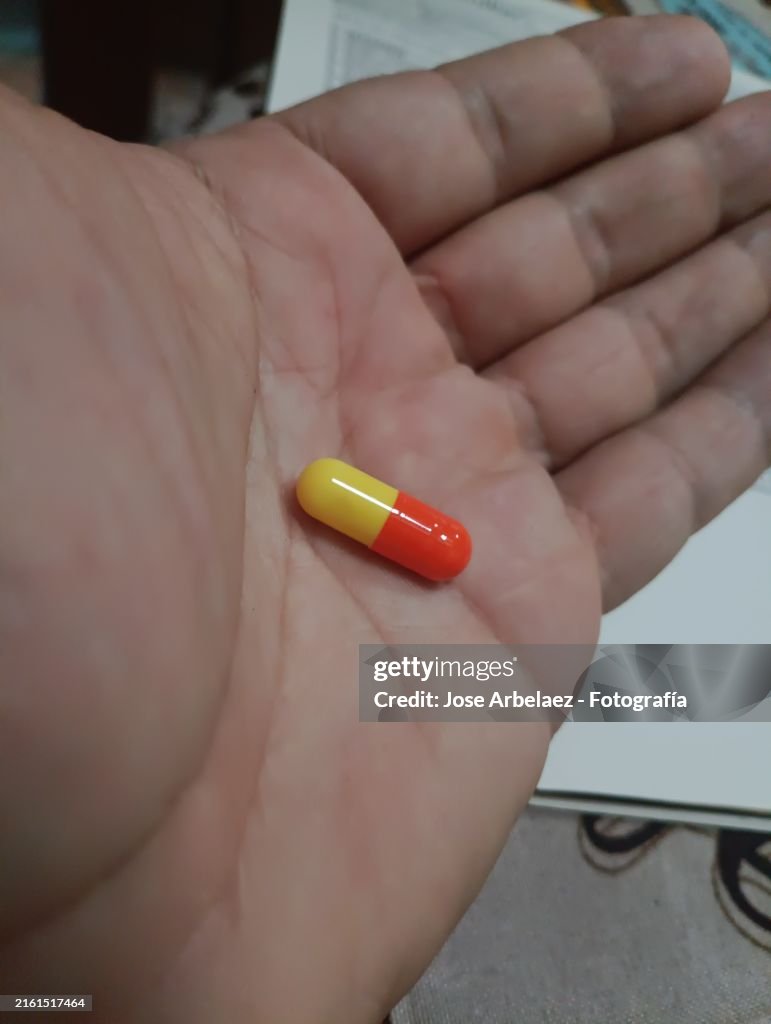 Hand with medicine pill