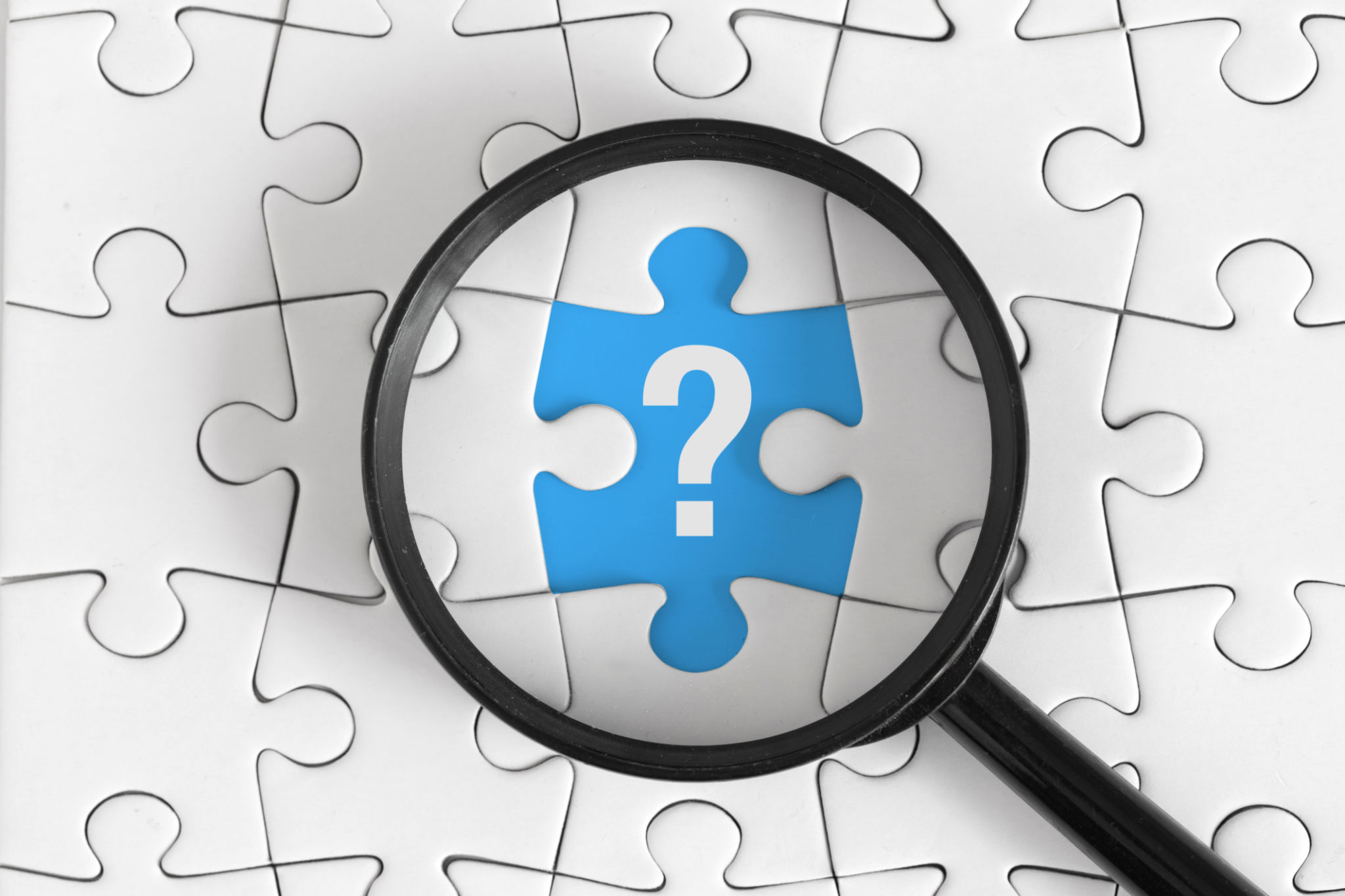 White Puzzle with Black Magnifying Glass and White Question Mark on Blue Piece, Top View White Puzzle with Black Magnifying Glass and White Question Mark on Blue Piece, Top View