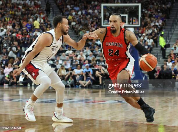 Dillon Brooks of Canada drives against Stephen Curry of the United States in the first half of their exhibition game ahead of the Paris Olympic Games...