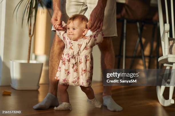 first steps of my baby - primeiros passos imagens e fotografias de stock