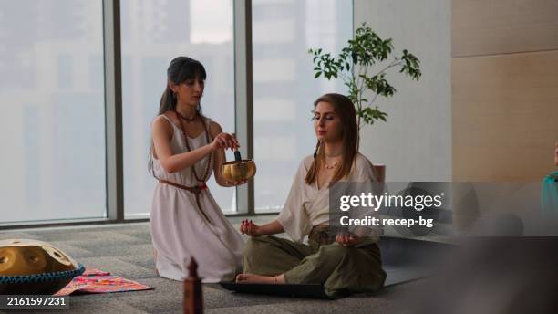 performers and group of people joining music and sound therapy session - alternative medicine stock pictures, royalty-free photos & images