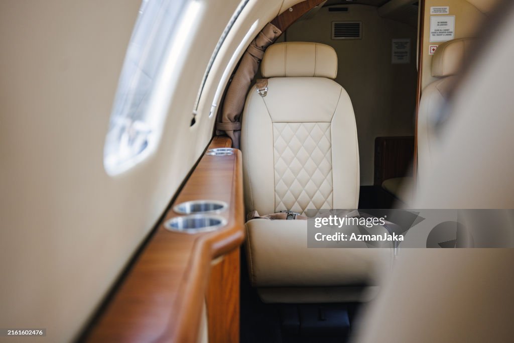 Luxury Private Jet Interior with Leather Seats and Wood Accents