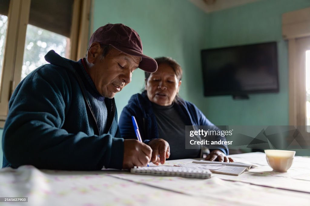 Woman teaching her husband how to read