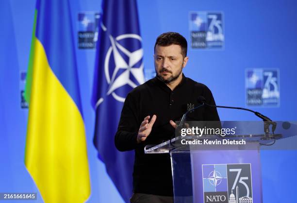 Ukrainian President Volodymyr Zelensky speaks during a joint press conference with NATO Secretary Jens Stoltenberg at the 2024 NATO Summit on July...