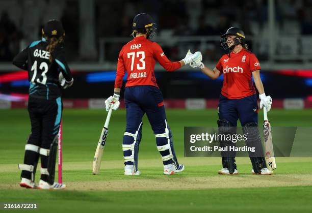 Alice Capsey and Freya Kemp of England celebrate winning the 3rd Women's Vitality IT20 between England and New Zealand at the Spitfire Ground on July...