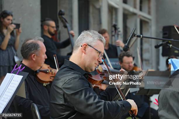 Musicians of the Kyiv Classic Orchestra are performing during the requiem for the victims of the Russian missile attack on the Ohmatdyt National...