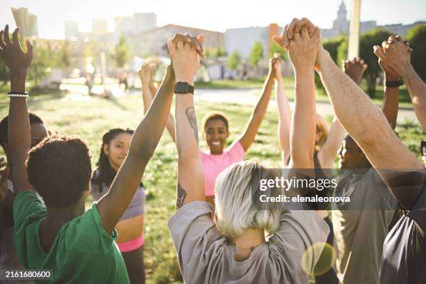 yoga classes in nature - body image stock pictures, royalty-free photos & images