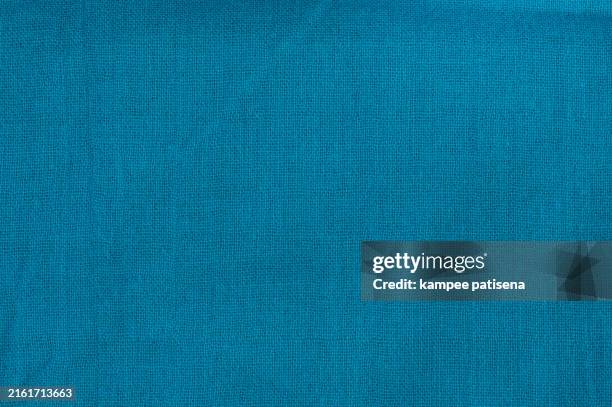 a blue cotton fabric with a wave pattern background - canvas fabric stock pictures, royalty-free photos & images
