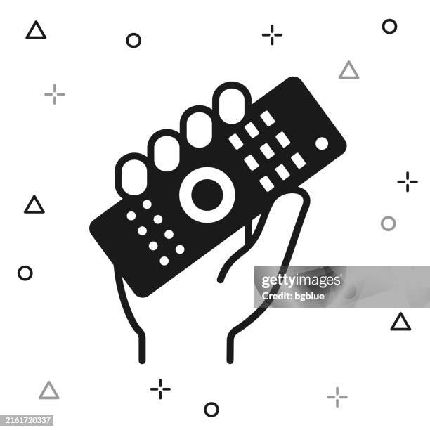 hand holding up remote control. icon on white background - remote controlled stock illustrations