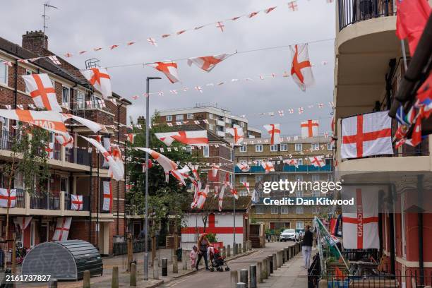 England flags flutter ahead of Sunday's UEFA Euro 2024 final between England and Spain at the Kirby Estate on July 12, 2024 in London, England....