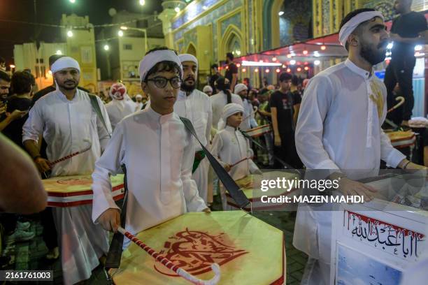 Shiite Muslims take part in the rituals of Ashura, commemorating the 7th century killing of Prophet Muhammad's grandson Imam Hussein, in Manama on...