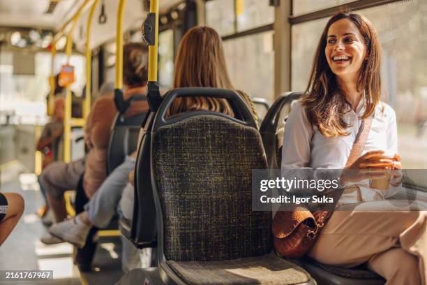 young woman on public transportation - moving a vehicle stock pictures, royalty-free photos & images