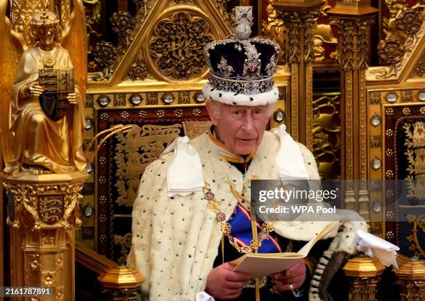 King Charles III wearing the Imperial State Crown and the Robe of State reads the King's Speech at the State Opening of Parliament in the House of...