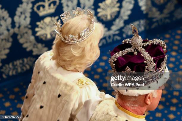 King Charles III wears the Imperial State Crown and Queen Camilla wears the Diamond Diadem during a ceremony on the day of the State Opening of...