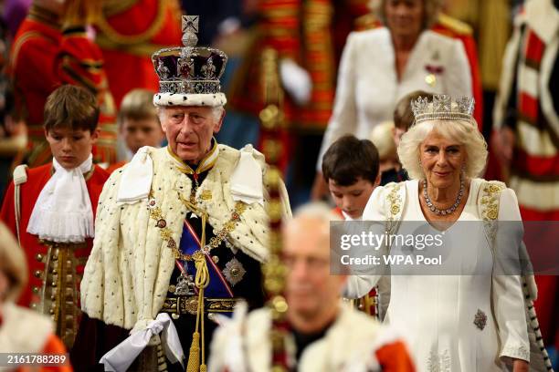 King Charles III wears the Imperial State Crown and Queen Camilla wears the Diamond Diadem during a ceremony on the day of the State Opening of...
