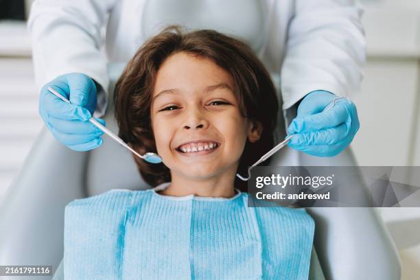 child at the dental office - dental office stock pictures, royalty-free photos & images
