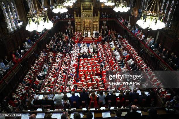 King Charles III, wearing the Imperial State Crown and the Robe of State, sits alongside Queen Camilla, wearing the George IV State Diadem, as he...
