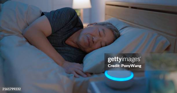 old man use white noise - smart speaker stock pictures, royalty-free photos & images