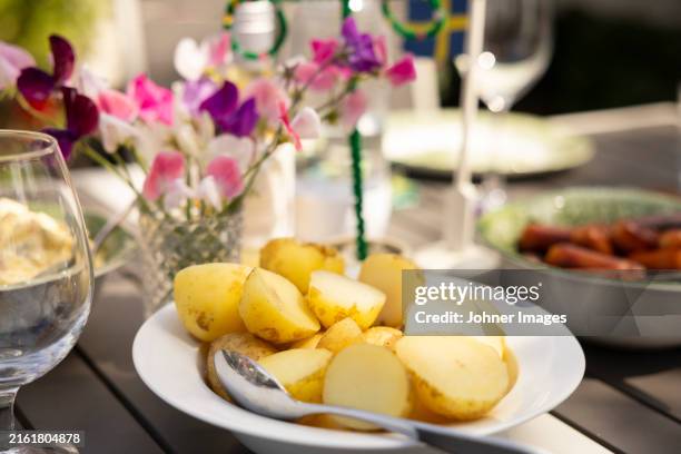 close-up of boiled potatoes served in plate on table - bollito foto e immagini stock