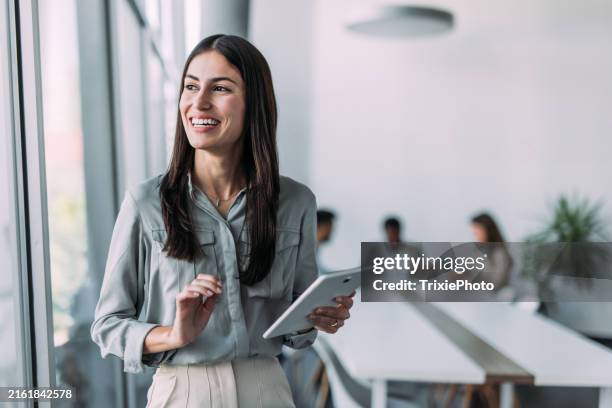 successful businesswoman in the office. - looking away stock pictures, royalty-free photos & images