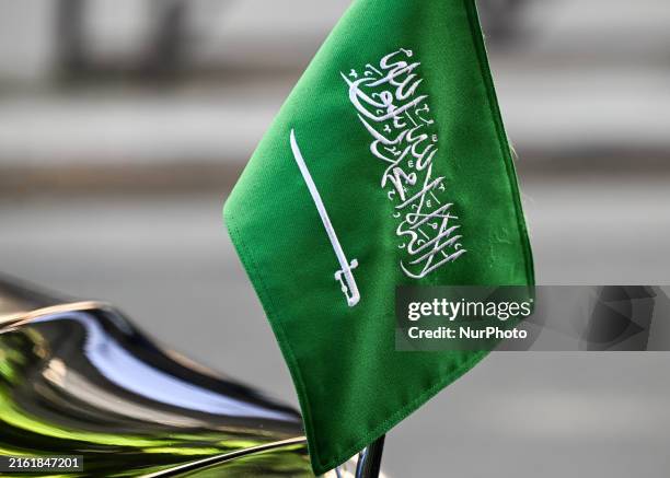 Flag of the Kingdom of Saudi Arabia, seen on the Saudi Ambassador's vehicle parked near Avenue Foch in Paris, during the Bastille Day military...