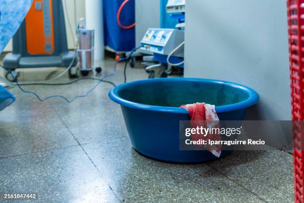 medical waste covered with blood in a container in the operation room - soiled-linens-hospital stock pictures, royalty-free photos & images