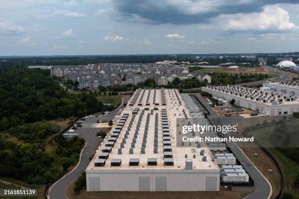 In an aerial view, the IAD71 Amazon Web Services data center is shown on July 17, 2024 in Ashburn, Virginia. Northern Virginia is the largest data...