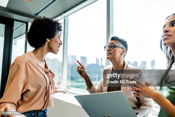 anger coworkers during a meeting at office - annoying colleague stock pictures, royalty-free photos & images