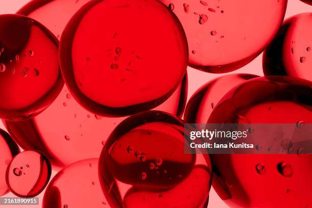 red drops, bubbles, molecules. close-up. 3d pattern. healthcare and medicine. - texture maquillage photos et images de collection