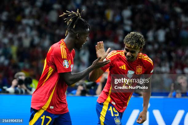 Nico Williams left winger of Spain and Athletic Club Bilbao celebrates with Lamine Yamal right winger of Spain and FC Barcelona after scoring his...