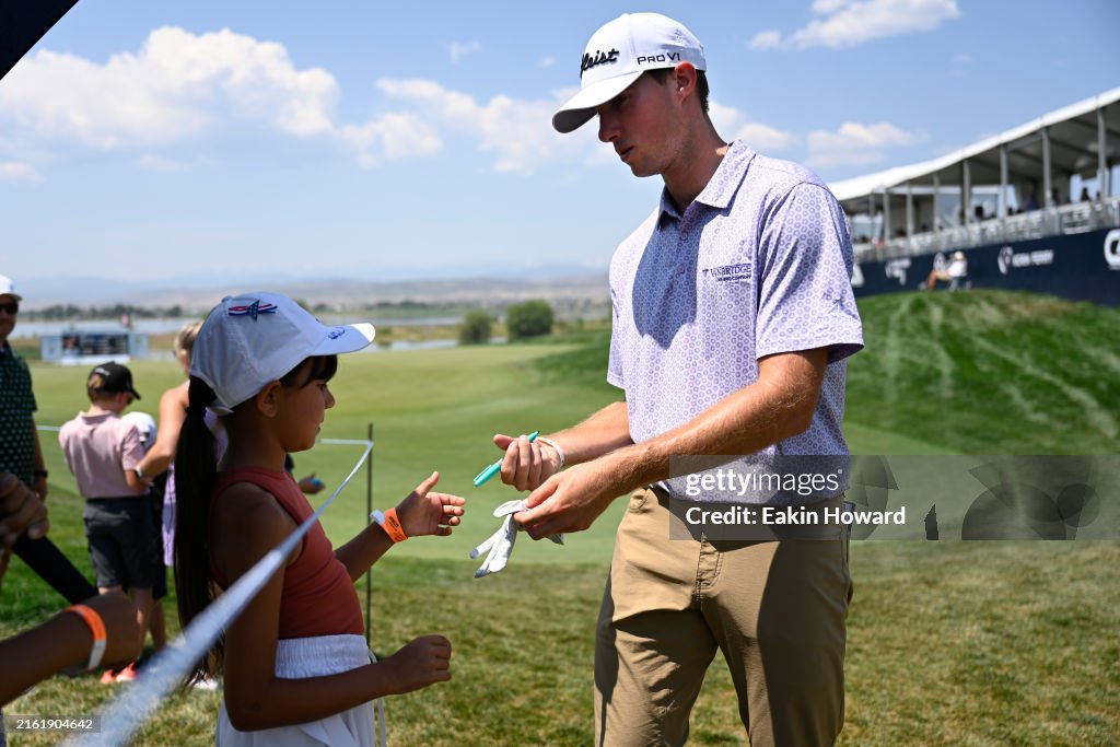 After Ridel Matthew Riedel signs autographs after finishing on the 18th green ...