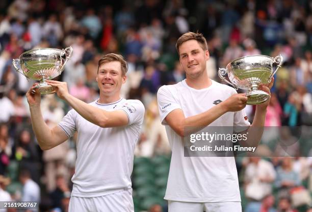 Harri Heliovaara of Finland and Henry Patten of Great Britain pose with their Gentlemen’s Doubles Trophies following victory against Max Purcell and...