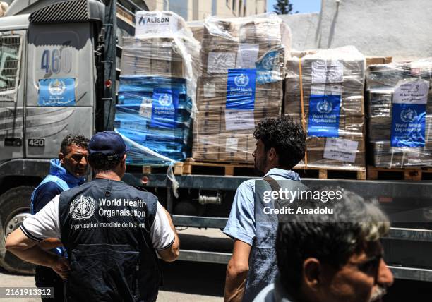 Trucks, carrying medicines and medical supplies delivered by the World Health Organization , arrive al-Ahli Baptist Hospital in Gaza City, Gaza on...