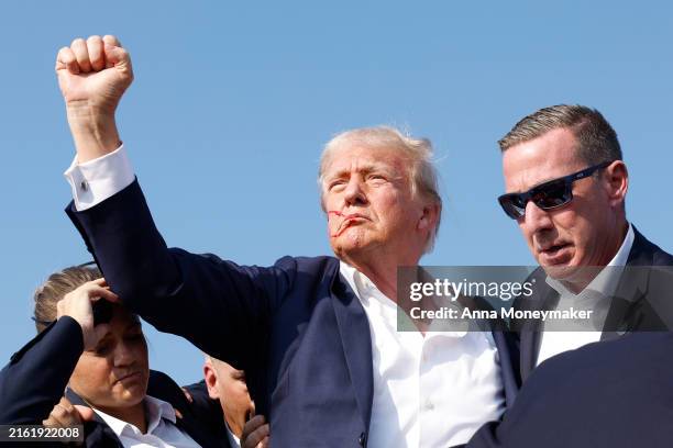 Republican presidential candidate former President Donald Trump is rushed offstage during a rally on July 13, 2024 in Butler, Pennsylvania. Butler...