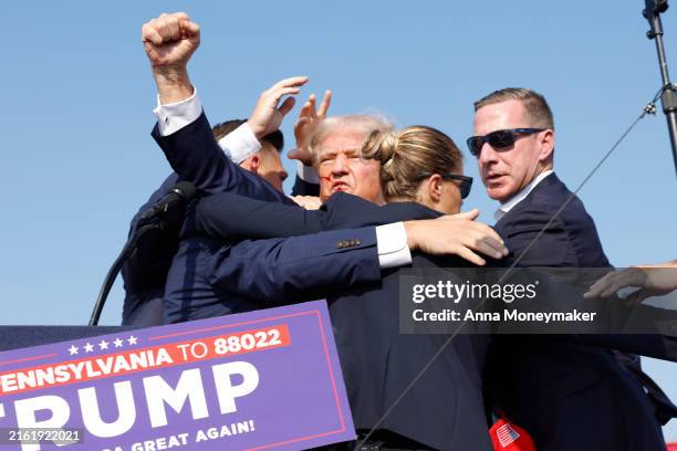 Republican presidential candidate former President Donald Trump is rushed offstage during a rally on July 13, 2024 in Butler, Pennsylvania. Butler...