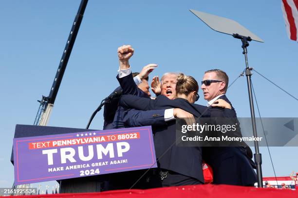 Republican presidential candidate former President Donald Trump is rushed offstage during a rally on July 13, 2024 in Butler, Pennsylvania. Butler...
