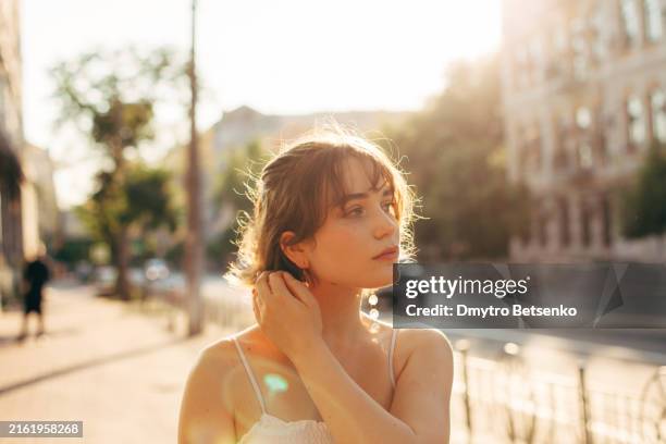 beautiful young woman walking on the city street during summer - ukraine people stock pictures, royalty-free photos & images