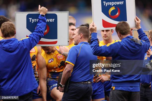Jarrad Schofield, interim senior coach of the Eagles addresses the team at the quarter time break during the round 18 AFL match between West Coast...