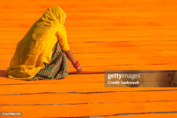 colors of india - woman checking dyed fabrics, rajasthan, india - indigenous culture stock pictures, royalty-free photos & images