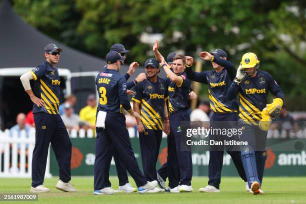 Andy Gorvin of Glamorgan celebrates with team-mates after claiming the wicket of James Bracey of Gloucestershire during the T20 Vitality Blast match...
