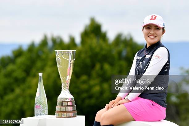 Ayaka Furue of Japan poses with the trophy after wining the Amundi Evian Championship on the 18th hole during the final round of the Amundi Evian...
