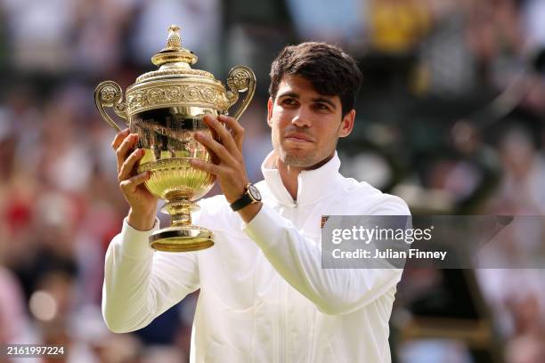 Carlos Alcaraz of Spain poses with the Gentlemen's Singles Trophy following victory against Novak Djokovic of Serbia in the Gentlemen's Singles Final...