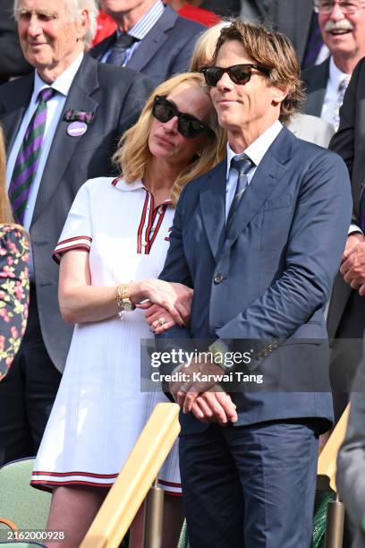 Julia Roberts and Daniel Moder court-side of Centre Court during the men's final on day fourteen of the Wimbledon Tennis Championships at the All...