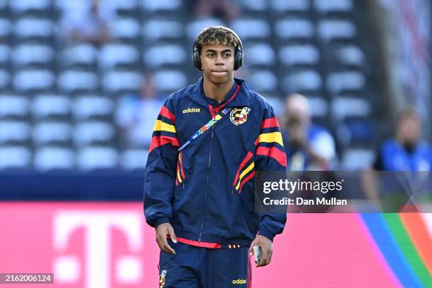 Lamine Yamal of Spain looks on as he inspects the pitch prior to the UEFA EURO 2024 final match between Spain and England at Olympiastadion on July...