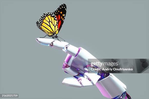robot holding butterfly - cyborg stock-fotos und bilder