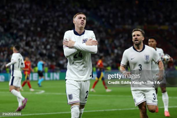Cole Palmer of England celebrates scoring his team's first goal with teammate Luke Shaw during the UEFA EURO 2024 final match between Spain and...