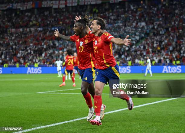 Mikel Oyarzabal of Spain celebrates scoring his team's second goal with teammate Nico Williams during the UEFA EURO 2024 final match between Spain...