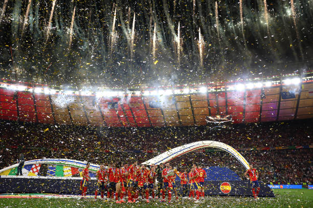 General view inside the stadium as pyrotechnics are set off as Alvaro Morata of Spain lifts the UEFA Euro 2024 Henri Delaunay Trophy after their...